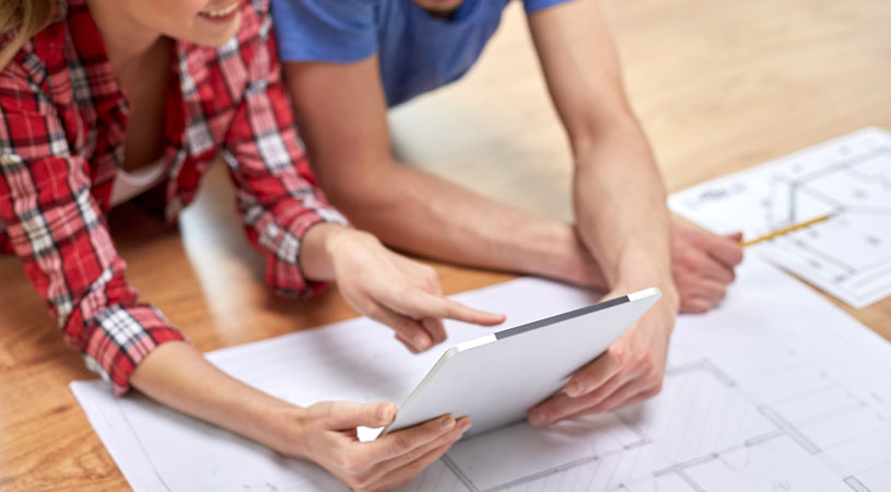 couple looking at home renovation plans