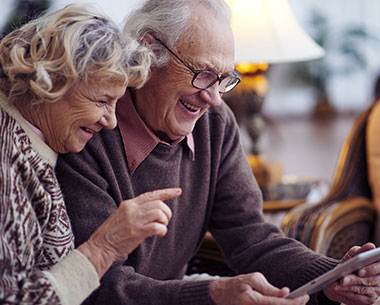 elderly couple on tablet